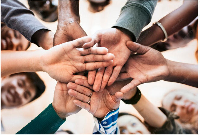 Hands stacked together — symbolizing club membership and shared interests